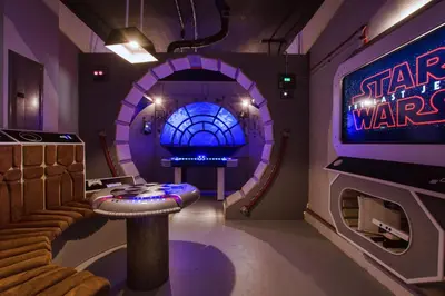 a room with a star wars room with a tv at Chic Home Themed Bedrooms Game Room Best Spot in Kissimmee