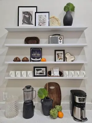 a shelf filled with lots of pictures and a blender at The Catherine - 1 mile to downtown - 2 King beds - Sleeps 5 in Orlando