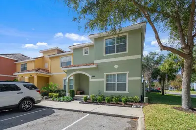 a white car parked in front of a house at 5 BD 4 BA Private Pool Paradise Palms (8839 CP) in Kissimmee