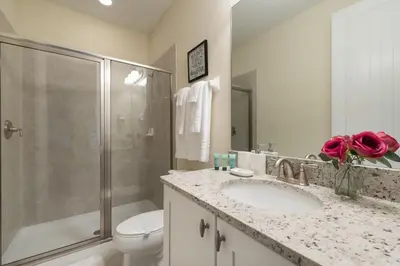 a bathroom with a sink and a toilet and a shower at Fabulous Disney Vacation Home in Orlando