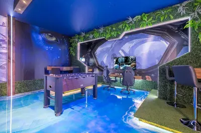 a childrens room with a blue ceiling and a room with a bed at Fabulous Disney Vacation Home in Orlando