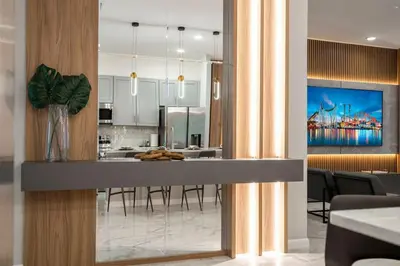 a kitchen and dining room with a dining table at The Best Paradiso Vacation House in Orlando
