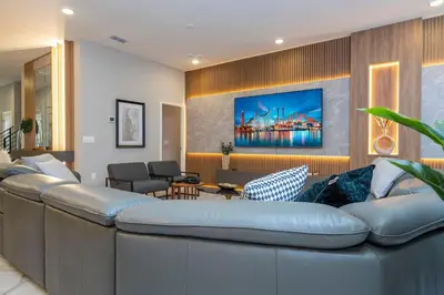 a living room with a large blue couch at The Best Paradiso Vacation House in Orlando