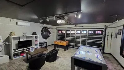 a living room with a table and a tv at Wonderful Villa with swimming pool, near Orlando attractions in Kissimmee