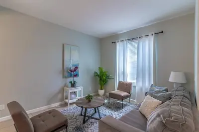 a living room with a couch and a table at 2614 Veranda Palms in Kissimmee