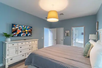 a bedroom with a bed and a tv on the wall at 2614 Veranda Palms in Kissimmee
