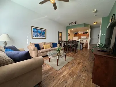 a living room with a couch and a table at 3 Bedroom 2 Bathroom Villas At SevenDwarfs 21-103 in Kissimmee