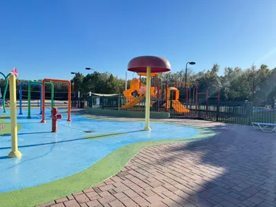 a park with a playground with a slide at 3 Bedroom 2 Bathroom Villas At SevenDwarfs 21-103 in Kissimmee