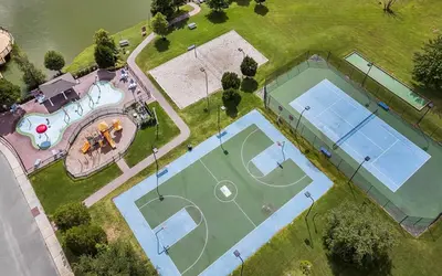 an overhead view of two tennis courts on a field at 3 Bedroom 2 Bathroom Villas At SevenDwarfs 27-106 in Kissimmee