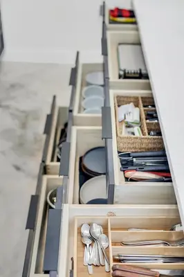a drawer full of dishes and utensils at Florida HappyNest Secluded Luxury Guesthouse in Kissimmee