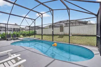 a swimming pool with a iguana in a tent at Luxury 4-Bedroom Home with Private Pool, Jacuzzi, AC, Wi-Fi, Cable TV, 5 Minutes from Disney in Kissimmee