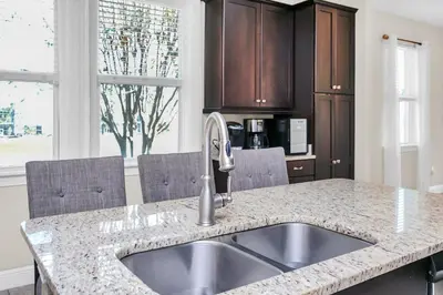 a kitchen with a sink and a counter top at Luxe Family Escape at Encore at Reunion in Orlando