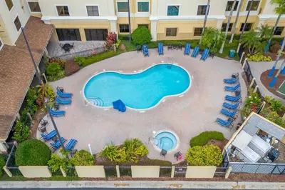 an overhead view of a swimming pool in a resort at Cozy Orlando Getaway with Pool Access in Orlando