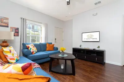 a living room with a blue couch and a table at happy place in Kissimmee