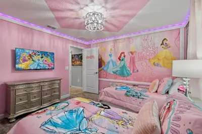a bedroom with two beds and a disney princess mural at Lakeview 5BR with Game Room and Pool, Near Disney in Kissimmee