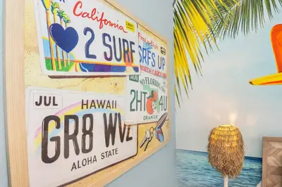 a room with a wall of stickers on the wall at The Ultimate Family Getaway in Kissimmee