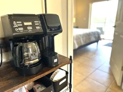a coffee maker on a shelf in a living room at Amazing! Disney 7 Min, Walmart 1 min, 3 Bed 2 bt in Orlando