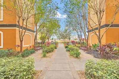 a walkway in a park next to a building at Orlando Getaway at Floridays Resort in Orlando