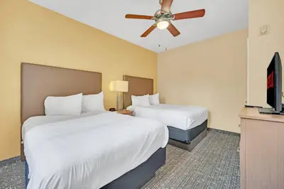 a hotel room with two beds and a ceiling fan at Orlando Getaway at Floridays Resort in Orlando