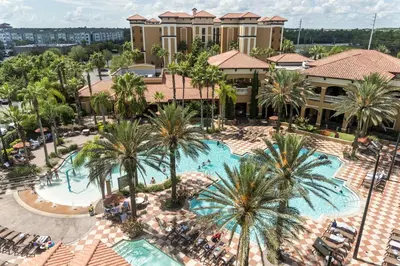 an aerial view of a resort with a pool and palm trees at Orlando Getaway at Floridays Resort in Orlando