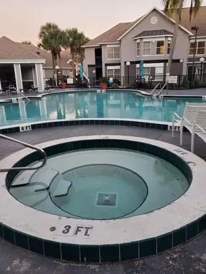 a large swimming pool in a resort at Nice 2 Miles from DISNEY Condo 1 Bedroom 1 Bath in Orlando