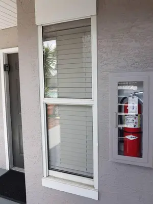 a window of a house with a fire hydrant in it at Nice 2 Miles from DISNEY Condo 1 Bedroom 1 Bath in Orlando
