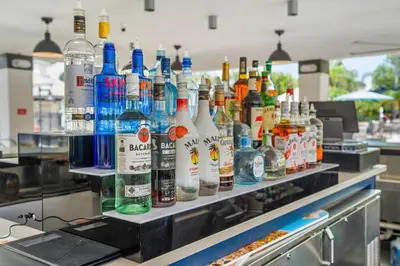 a counter with many bottles of alcohol on it at Epic Universe New Beautiful Townhome - 4033 in Orlando