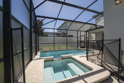 a swimming pool in a house with a glass ceiling at Luxury 5 Bedroom 5 bath private pool Home 279 in Kissimmee