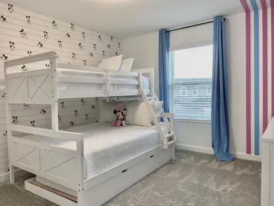 a bedroom with a white bunk bed with a teddy bear at Beautiful 4 bedroom 3 bath pool Townhome 280 in Kissimmee