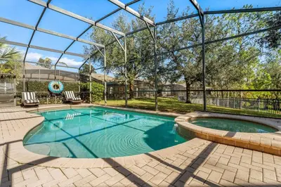 a large swimming pool with a glass roof at The Colorful Cove in Orlando