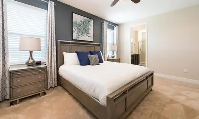a bedroom with a large bed and a window at 7412 MA - Stylish Home Near Parks in Orlando