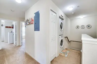 a laundry room with a washer and dryer at 14 Mi to Disney World Kissimmee Condo with Perks! in Kissimmee
