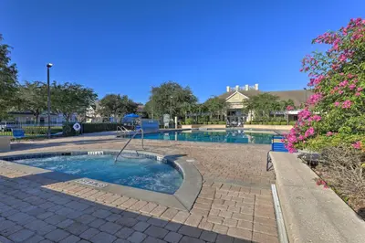 a swimming pool with a playground in a park at 14 Mi to Disney World Kissimmee Condo with Perks! in Kissimmee