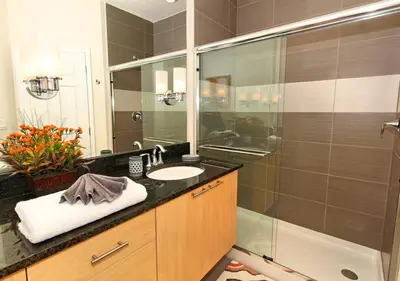 a bathroom with a sink and a shower at 17413 Luxury Pool Villa Serenity Haven, 3BR, Balcony in Orlando