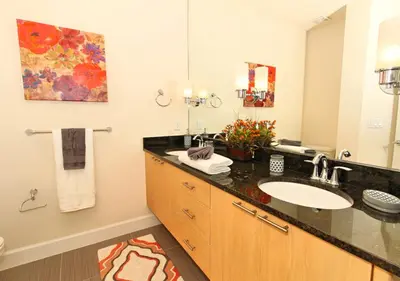 a bathroom with a sink and a large mirror at 17413 Luxury Pool Villa Serenity Haven, 3BR, Balcony in Orlando