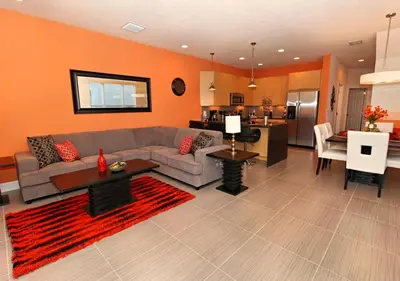 a living room with a couch and a table and a kitchen at 17413 Luxury Pool Villa Serenity Haven, 3BR, Balcony in Orlando
