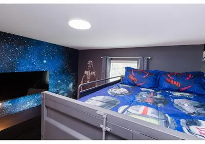 a bedroom with a star wars themed bed and a television at 2489 RT Ultimate Villa Oasis with Pool & Spa Sleeps 13 in Kissimmee