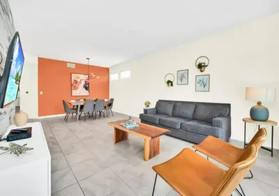 a living room with a couch and a table at Luxury 3-Bed Condo in Storey Lake Resort - 3131 in Kissimmee