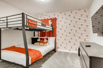 a bedroom with a bunk bed with two stuffed animals at Stunning 6BR Home, Private Pool & Spa - 14 Guests - 4507 NL in Kissimmee