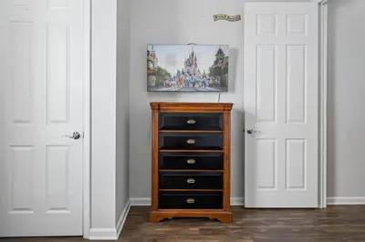 a room with two white doors and a dresser at 4816 Cayview Avenue 407 in Orlando