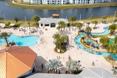 an overhead view of a pool at a resort at 4812 BR - Enchanted Lakeside Escape Luxurious Family Retreat in Kissimmee
