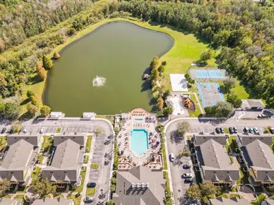 an aerial view of a resort with a lake at 4562 YR Amazing in Kissimmee