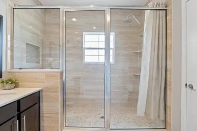 a shower with a glass door in a bathroom at Resort Home by Disney Themed Jacuzzi Pool 2666 in Orlando