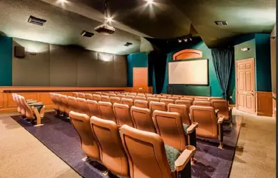 a lecture room with a bunch of chairs and a screen at Beautiful Apartment Near Disney in Kissimmee