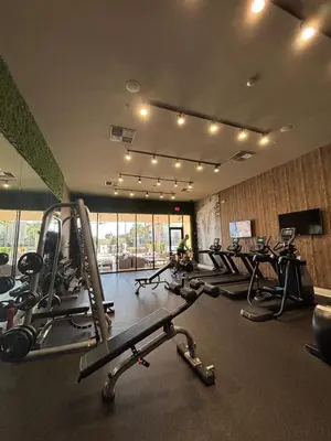 a gym with a bunch of treadmills and machines at Luxury Home 7 Min Disney Universal 3BR4BA - Hot Tub in Orlando