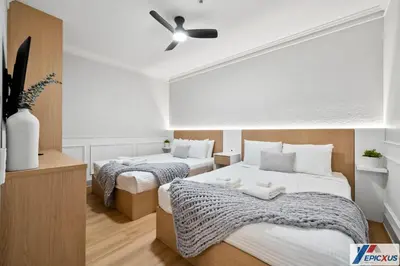 a bedroom with two beds and a ceiling fan at The epic Orlando Vista Cay in Orlando