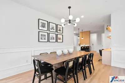 a dining room with a wooden table and chairs at The epic Orlando Vista Cay in Orlando
