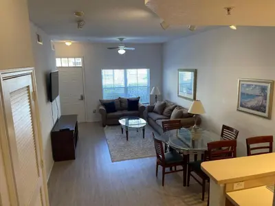 a living room with a couch and a table at 3 Bedroom 2 Bathroom Villas At SevenDwarfs 19-106 in Kissimmee