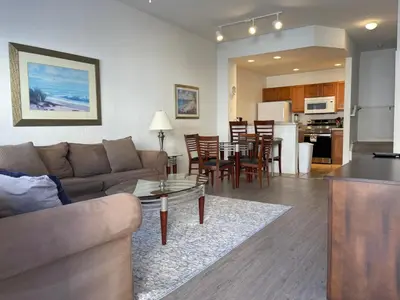 a living room and kitchen with a couch and a table at 3 Bedroom 2 Bathroom Villas At SevenDwarfs 19-106 in Kissimmee