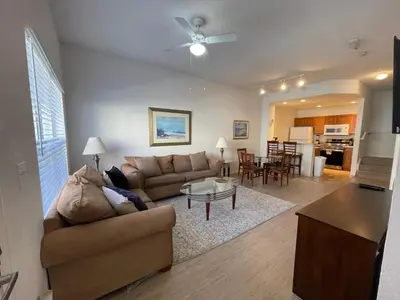 a living room with a couch and a table at 3 Bedroom 2 Bathroom Villas At SevenDwarfs 19-106 in Kissimmee